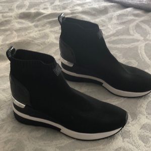 Michael Kors size 7 boots. Hardly worn, no box. Stretchy front
